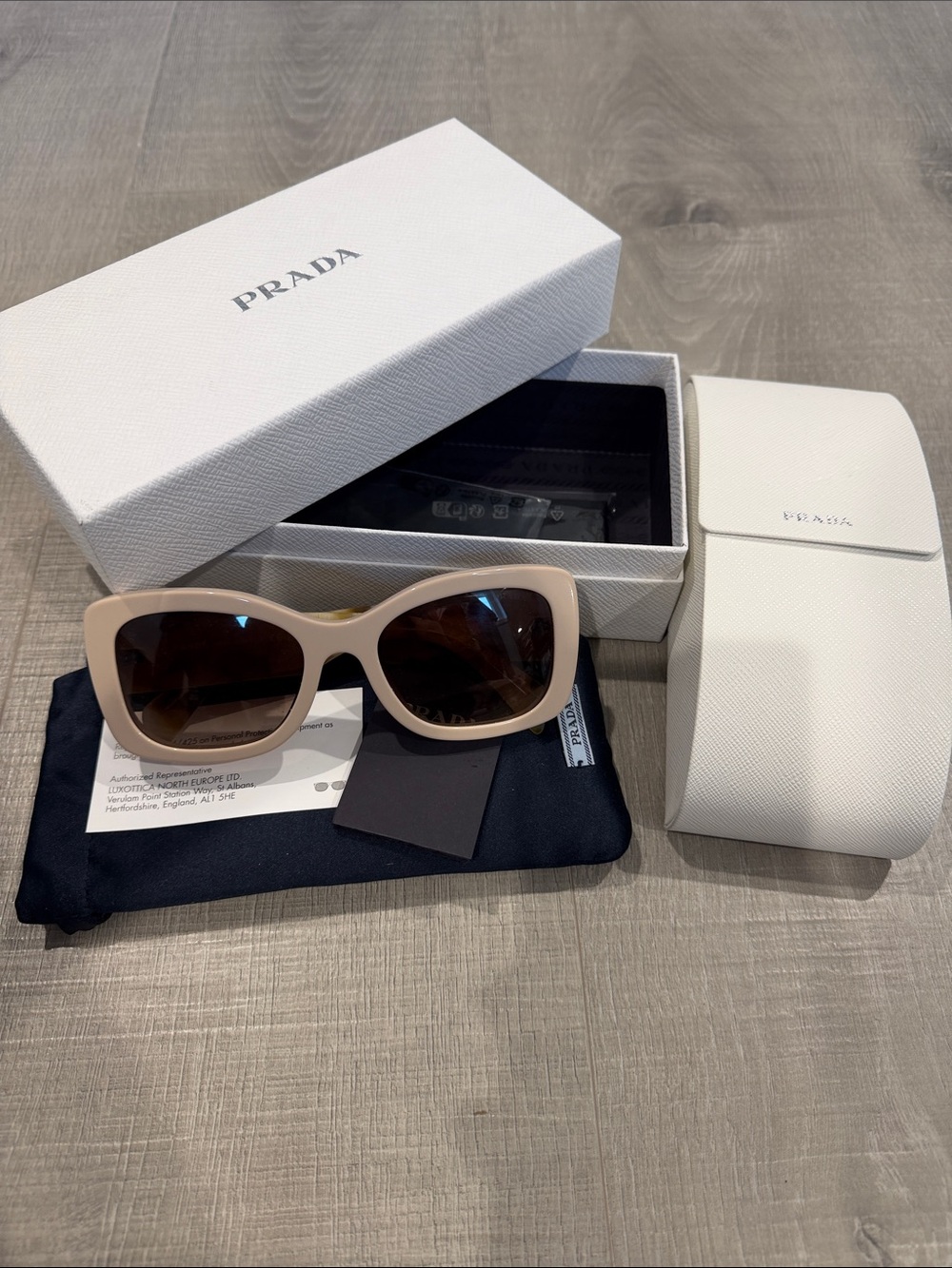 Prada Beige Cat-Eye Sunglasses with Brown Lenses